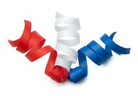 Isolated red, white, and blue ribbons arranged in flowing waves on transparent background, ready for patriotic designs, celebrations, and promotional graphics.