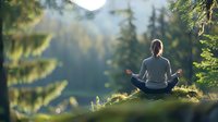 Young Caucasian woman in lotus position meditating at sunrise in misty mountain forest, wearing grey sportswear, back view. Wellness and mindfulness concept.
