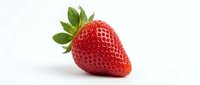 Fresh red strawberry with green leaves isolated on white background, suitable for food packaging, recipe blogs, and healthy eating designs.