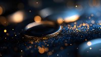 Elegant metallic ring with sparkling gold and blue bokeh particles floating around it, creating a luxurious and sophisticated atmosphere suitable for jewelry advertising and premium product marketing.