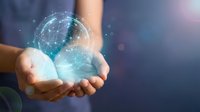 Hands holding glowing digital globe with network connections representing global technology, innovation, and futuristic communication concepts.