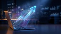 Digital growth arrow emerging from laptop screen with glowing particles and data visualization effects representing business success and financial progress.