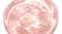 Transparent gel texture with swirling patterns and bubbles, isolated on white background for cosmetic, skincare, and beauty product design applications.