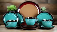 Elegant turquoise and burgundy ceramic dinnerware set with teacups, saucers and plates arranged on wooden surface, modern tableware collection for home decor and dining.
