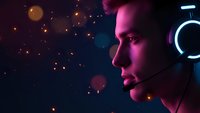 Young male gamer with headset in neon-lit gaming setup with bokeh lights background for esports and streaming content.