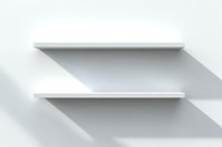 Empty white floating shelves casting diagonal shadows on light wall, minimalist modern interior design element for product display and storage solutions.