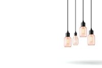 Minimalist pendant lamps with warm glowing filaments hanging at different heights against white background, modern industrial lighting design for home decor and interior styling.