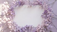 Delicate purple baby's breath flowers creating elegant frame border on soft pastel background for wedding invitations and romantic design projects.