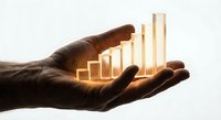 Male hand holding glowing golden bar chart showing business growth and financial success against light background for presentations and reports.