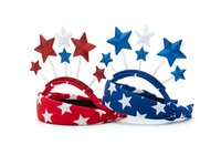 Patriotic red and blue star-patterned headbands with coordinating star decorations on stems, isolated on white background, suitable for holiday crafts, party supplies, and festive designs.