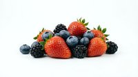 Fresh mixed berries pile with strawberries blueberries and blackberries isolated on white background for healthy eating and nutrition concepts.