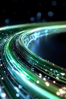 Glowing green and blue fiber optic cables curve against dark background with bokeh light effects, creating futuristic technology concept for connectivity designs.