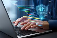 Businessman hands typing on laptop with digital cybersecurity shield and data streams for online protection and secure business technology solutions.