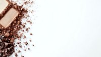 Crushed brown eyeshadow powder and makeup palette scattered on white background, cosmetic texture close up view for beauty and fashion industry.