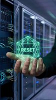 IT administrator holding glowing green reset button hologram in modern server room data center for system recovery and network maintenance operations.