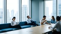 Modern office meeting room with diverse business team collaborating at conference table near floor-to-ceiling windows overlooking urban cityscape skyline.