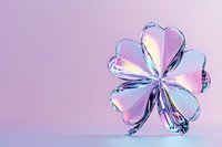 Iridescent holographic clover shape on pink background with rainbow reflections and metallic surface creates modern minimalist composition.