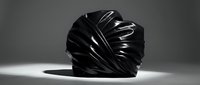 Abstract black sculptural form with flowing organic curves and dramatic lighting creating artistic shadows on white surface.