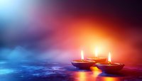 Glowing oil lamps with burning flames against mystical blue and orange background create spiritual atmosphere for meditation and religious ceremonies.