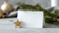 Blank white greeting card with golden star decoration and pine branches on light background, festive holiday mockup for Christmas or New Year message.