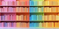 Colorful rainbow gradient bookshelf with organized books arranged by color from pink to yellow, creating vibrant ombre effect in modern library or bookstore interior.