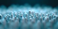 Mysterious glowing spheres in rows create abstract macro pattern against dark background, soft focus bokeh effect creates dreamy atmospheric composition.
