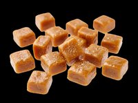 Caramel candy cubes isolated on transparent background, ready for design use on t-shirts, stickers, clipart, print-on-demand products, and sublimation projects.