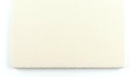 Blank cream colored paper sheet with soft shadow on white background for mockup and design projects.