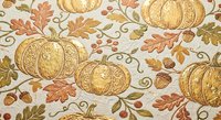Autumn harvest seamless pattern with golden pumpkins, oak leaves, acorns and decorative swirls on cream background. Perfect for seasonal designs and crafts.