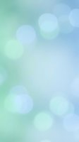 Soft gradient bokeh background with dreamy light circles in mint green and blue tones for web design and presentations.