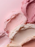 Pink makeup foundation cream smears and swatches on pastel background for cosmetic beauty product advertising and skincare branding campaigns.