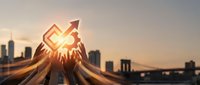 Hands holding glowing upward arrow symbol at sunset with city skyline, representing business growth, success, financial progress and corporate achievement goals.