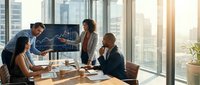 Business team analyzing financial data on monitor in modern office conference room with city skyline view during strategic planning meeting.