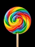 Rainbow swirl lollipop isolated on transparent background, ready for t-shirt design, stickers, clipart, print on demand, and sublimation projects.