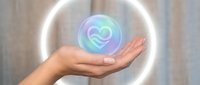 Female hand presenting holographic heart symbol with glowing circular light effect against soft blurred background for healthcare and wellness concepts.