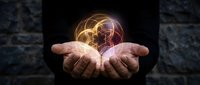 Businessman hands holding glowing brain with neural network connections representing artificial intelligence, machine learning and innovative technology solutions.