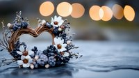 Heart shaped wreath with white daisies and blue berries on rustic wooden surface against soft bokeh lights background, romantic winter composition.