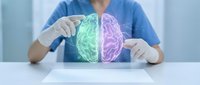 Medical professional in blue scrubs and white gloves examining holographic brain model showing left and right hemispheres in green and purple for neurology education and healthcare concepts.