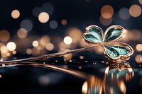 Delicate turquoise butterfly with metallic wings resting on reflective surface against blurred golden bokeh background, creating magical atmosphere.