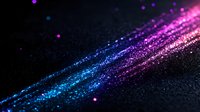 Diagonal streaks of glowing blue and purple particles on dark background create cosmic light effect with bokeh and sparkle elements for abstract design.