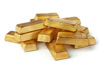Stack of shiny gold bars isolated on white background, showing wealth, investment and financial concept. Precious metal bullion arrangement.