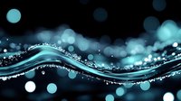 Flowing turquoise wave with sparkling water drops and bokeh lights on dark background creates magical aqua motion effect for luxury design projects.