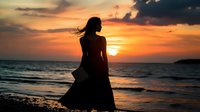 Young woman silhouette in flowing dress standing on beach at dramatic orange sunset over ocean, hair blowing in wind, peaceful solitary moment by seaside.