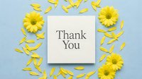 Thank you card surrounded by yellow daisy flowers and scattered petals on a soft blue background, expressing gratitude and appreciation.