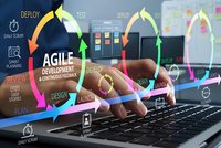 Agile development methodology concept with hands typing on laptop and colorful workflow arrows showing continuous feedback cycles for software projects.