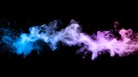 Vibrant blue and pink smoke trails blend together against black background creating ethereal flowing abstract shapes for creative design projects.