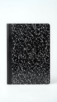 Black and white speckled composition notebook with marbled cover pattern isolated on white background for school and office supplies design.