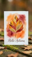 Watercolor autumn leaf greeting card with warm orange, red, and gold tones on white background. Seasonal design for fall celebrations and greetings.