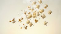 Floating golden popcorn kernels scattered in mid-air against neutral beige background creating dynamic motion effect for snack food advertising.