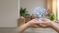 Hands holding glowing brain with neural network connections representing self-discovery and mental wellness in modern home interior setting.
